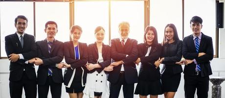 smiling happy Businessman and Businesswomen celebrating success Achievement Arm Raised and show thumb up Concept photo
