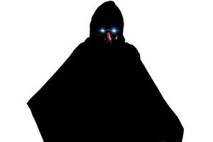 Portrait of an anonymous man, hacker wearing black suit and mask over white background with clipping path. photo