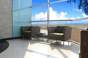 Seaside living room with wicker chairs photo