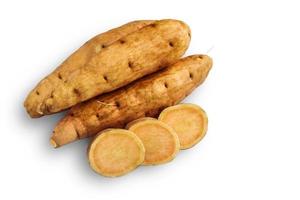 Pile of yellow yam with sliced isolated on a white background with clipping path. photo