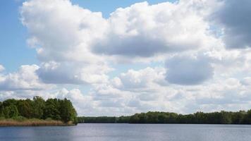 dramatic clouds over bathing lake photo