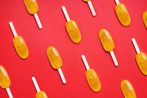 passion fruit popsicle or ice lolly or ice pop flat lay pattern photo
