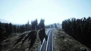 Natural Aerial view on the road and forest at the autumn time photo