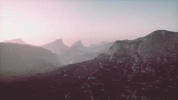 Rocks and mountains in deep fog photo