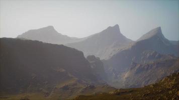 landscape of the Dolomites Mountain Range covered in the fog photo