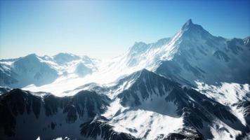 panoramic mountain view of snow capped peaks and glaciers photo