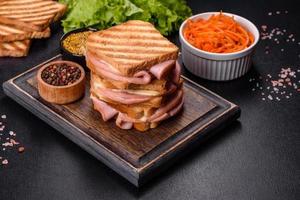 Delicious fresh toast grill with cheese and ham. Sandwiches, quick snack photo