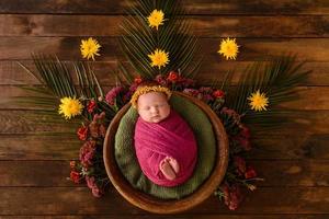 Close-up beautiful sleeping baby girl. Newborn baby girl, asleep on a blanket photo