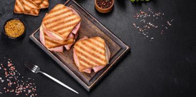 Delicious fresh toast grill with cheese and ham. Sandwiches, quick snack photo