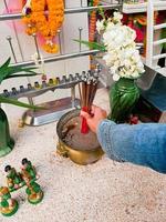 Use your hands to light incense and pray for sacred things for Buddhist rituals. photo