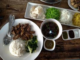 top view Thai food rice. on a wooden table. photo