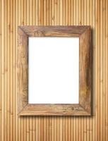 blank wooden frame on bamboo wall background photo