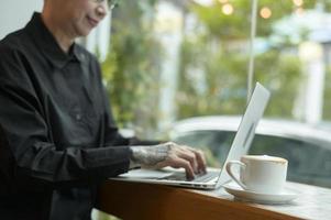 Portrait of senior businesswoman in coffee shop photo