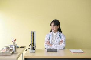 Portrait of young female doctor with stethoscope working at hospital, medical and health care concept photo