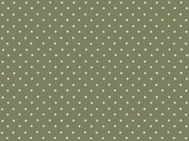 Polka dots on green background. photo
