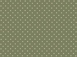 Polka dots on green background. photo