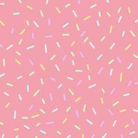 Colorful sprinkles on pink background. photo