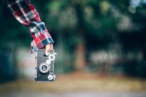 Hand and camera and travel photo