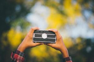 Hand and camera and travel photo