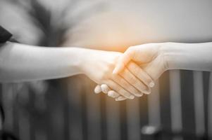 Join the hands of two people. And the greeting of friends. Communicate in team and teamwork. Teamwork concept photo