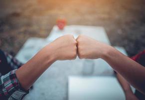 The hands of two people represent unity in work. Successful Business To be a good team photo