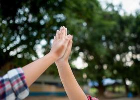 The hands of two people represent unity in work. Successful Business To be a good team photo