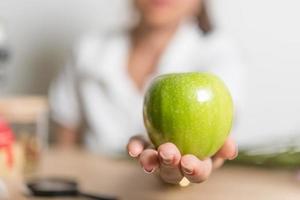 Hands and apples green photo