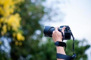 Hand and camera and travel photo