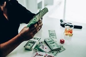 Money and hands of a young businessman. Success in the business. And his money. Put on the desk photo