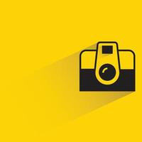 digital camera on yellow background vector