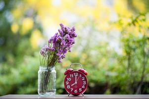 Purple flowers are placed on wooden boards. photo