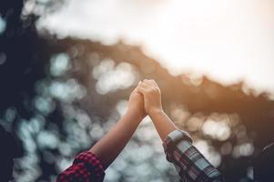 The hands of two people represent unity in work. Successful Business To be a good team photo