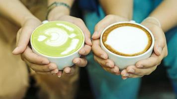 Hand and coffee and hot green tea Young people love to drink hot drinks. Healthy Coffee Food and Drink Concepts photo