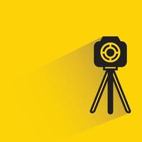 camera on tripod yellow background vector