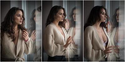 Attractive sexy brunette in white bra and brown sweater posing provocatively, near a window,studio shot. Portrait of sensual woman with long hair, in classic boudoir scene , looked out the window photo