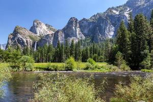 View across the Merced River to the mountains in Yosemite National Park photo