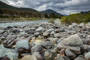 Boulders along the Maruia river in New Zealand photo