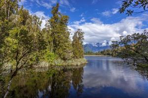 Scenic view of Lake Matheson in New Zealand in summertime photo