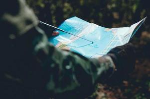 Soldiers are using the radio. And use the map For communication between military operations in the border forest. Guardian photo