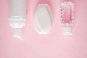 Cosmetic products on pink background. photo