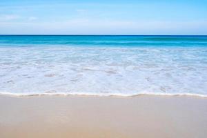 Phuket sea Beautiful tropical sandy beach with blue ocean and blue sky background image for nature background or summer background photo