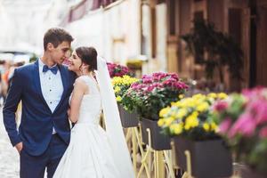 young couple at the cafe with flowers photo