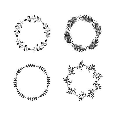 Four round vintage frames or wreaths of black branches with leaves on white background. Modern hand drawn floral design. Vector illustration