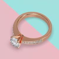 rose gold engagement solitaire ring with side stones on shank 3d render photo