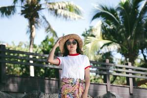 Portrait of young adult traveller asian woman with hipsters style outdoor on day photo