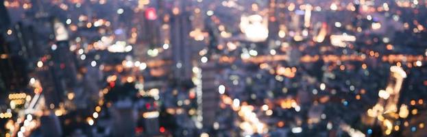 Blur bokeh background night city view with metropolis lifestyle people