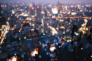 Blur bokeh background night city view with metropolis lifestyle people photo