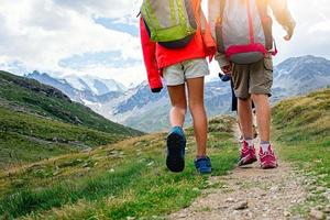 Children's mountain hike during a summer camp on the Swiss alps photo