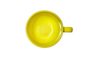 Top view green yellow empty clean round with handle ceramic coffee tea mug on isolated white background with space for text. Copy space. Minimal style. Concept layout for labeling and drinks placement photo