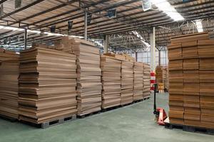 Stack of Corrugated Paper Preparing For Packaging in Factory photo